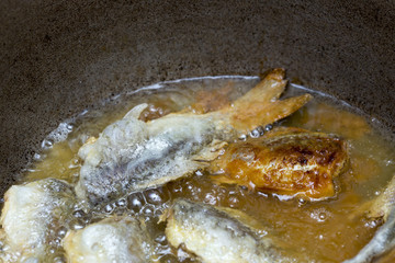 Fried fish in the kitchen