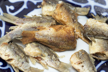 Fried fish in the kitchen