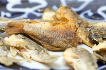 Fried fish in the kitchen