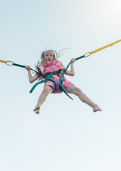 A girl in a dress flies up in stretch marks.