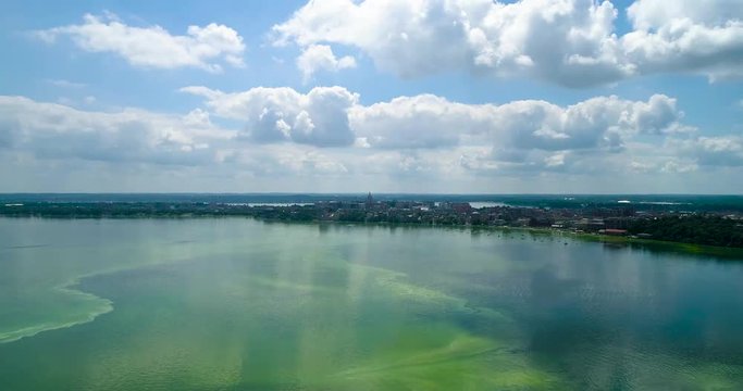 Drone over algal bloom lake with a view of the capital building (Madison, Wisconsin)