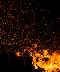 Flame of fire with sparks on a black background