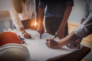 Engineering, architects, structural designers Foreman and engineer discussing with clients to find house design conclusions.