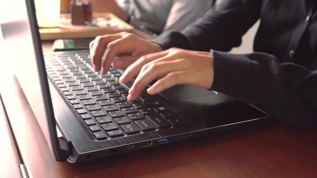  Woman hand using laptop and smartphone to work and study at working space. Business financial, trade stock maket and social network with freedom life concept.