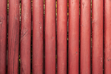 background, fence of red round sticks