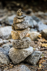Stack of stones by a stream in the park