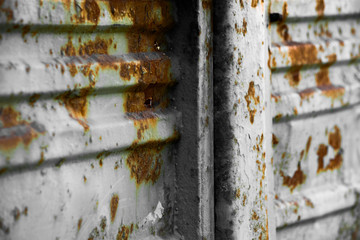Damaged rusty metal surface is close