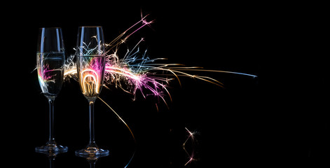 Two tall glasses of champagne against the background of Bengal l