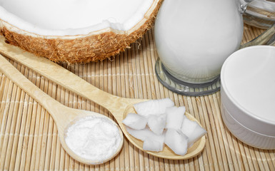 Coconut in cosmetology. Сream, balm, coconut milk. Skin, body and face care. Cosmetology. Nutrition and hydration. Homemade coconut products. Wooden spoons with coconut pulp and in powder.