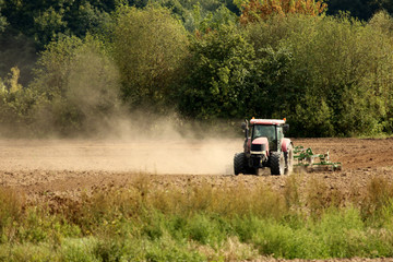 The tractor on agricultural field