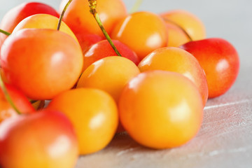 Ripe yellow-red cherry berries macro close-up.  Juicy berries, diet, healthy lifestyle.