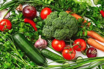 A set of vegetables, tomatoes, zucchini, broccoli, carrots, parsley, onions, cucumber. Fresh natural vegetables.