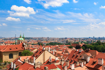 Fototapeta na wymiar Beautiful and ancient city of Europe - Prague, Czech Republic. View of the city from the observation deck. Small houses and the river Vltava. Charles Bridge and temples.