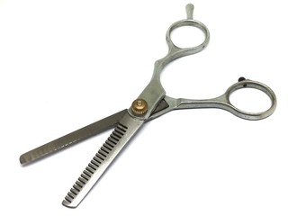 Isolated scissors for haircuts on white background.
