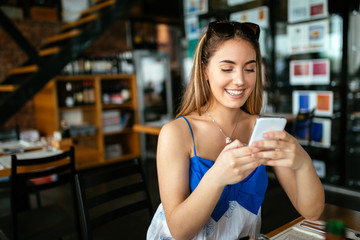 Beautiful brunette using cell phone