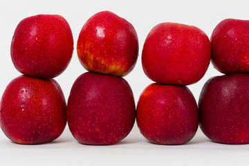 Red apples on the white background 
