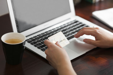 Fototapeta premium Girl Using Credit Card Payment Online with Coffee