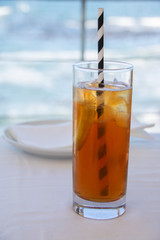 Iced tea with the ocean in the background