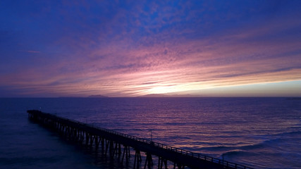 Fototapeta na wymiar Beach Pier Sunset Aerial