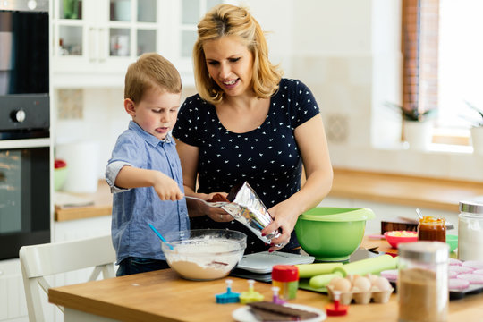 Beautiful child and mother baking