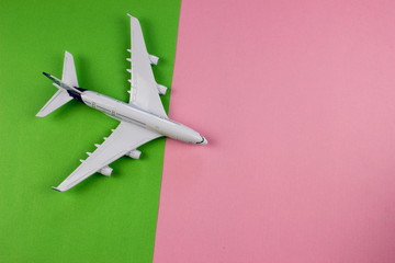 Plane model, aircraft on color background. Travel concept. 