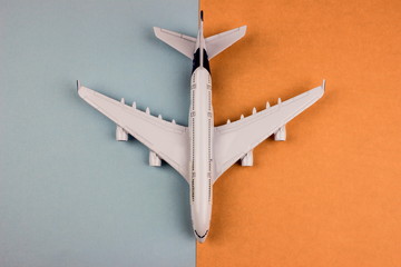 Plane model, aircraft on color background. Travel concept. 