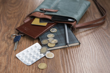 Search of tablets in a handbag. The contents of the handbag