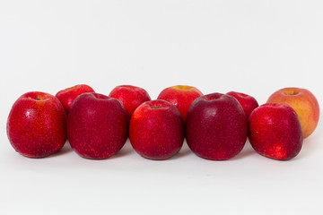 Red apples on the white background 