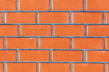 Wall from a red brick as an abstract background