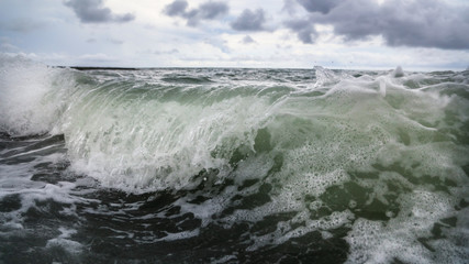 Storm waves on the seashore as a background