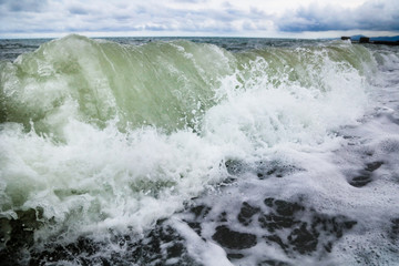 Storm waves on the seashore as a background