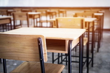 School empty classroom, Lecture room with desks and chairs iron wood for studying lessons in highschool thailand without young student, interior of secondary education with whiteboard