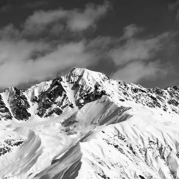 Fototapeta Black and white snow mountain peak at sunny day