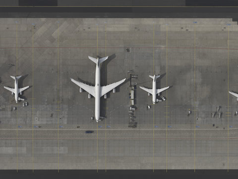 Aerial view airplanes parked on tarmac at airport