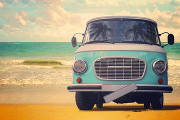Vintage van parked on the beach against the sea