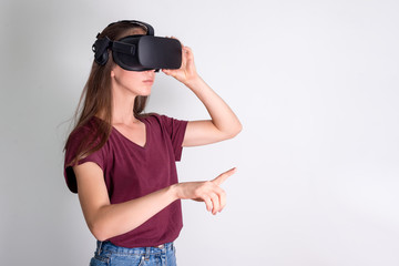 Young woman wearing virtual reality goggles headset, vr box. Connection, technology, new...