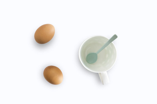 White cup and eggs separated from the white background with clipping path