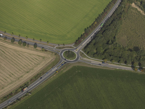 Aerial view roundabout amidst green agricultural fields near Frankfurt, Hessen, Germany