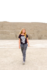 Huaca Pucllana Peru Lima Ancient excavations, ruins of pre-Inca culture The girl (blonde) is walking among the ruins