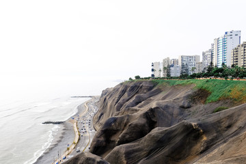 View of Lima, Peru. ocean, city, black sandy cliffs with an interesting relief