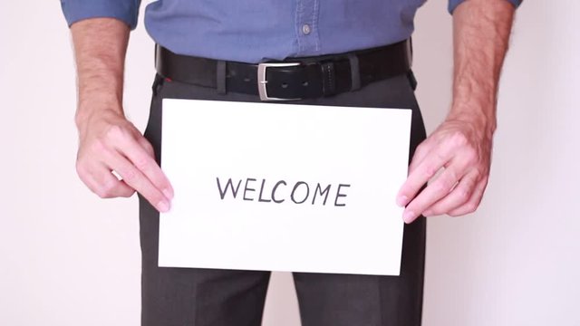 "Welcome" inscripton in front of genitals