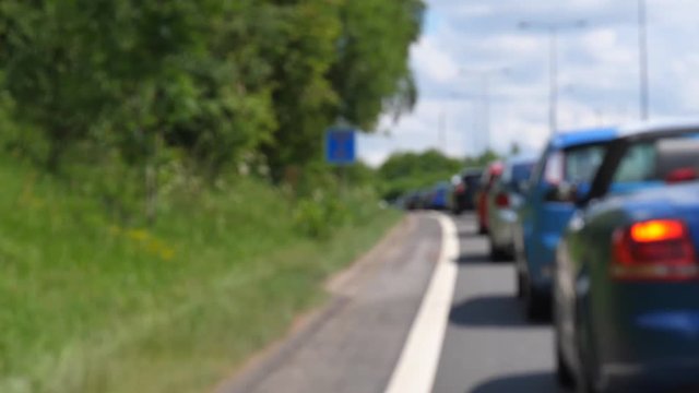 Travelling in the country on a nice sunny summer day, stuck in traffic jam
