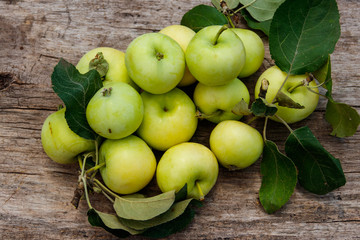 Fresh ripe apples on rustic wooden table