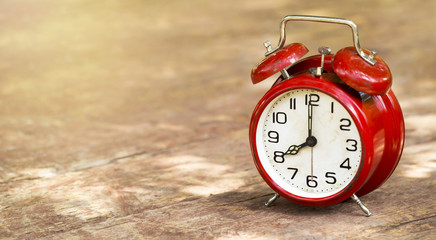 Daylight savings time concept - web banner of a vintage red alarm clock