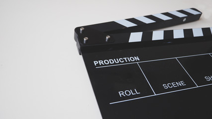 Fototapeta na wymiar Clapper board or movie slate use in video production or movie and cinema industry. It's black color on white background.