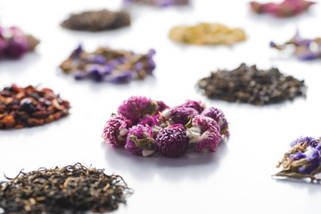 set of organic herbal dried tea on white tabletop