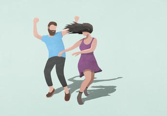 Carefree couple dancing on blue background