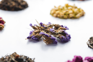 pattern of dried herbal natural tea on white surface