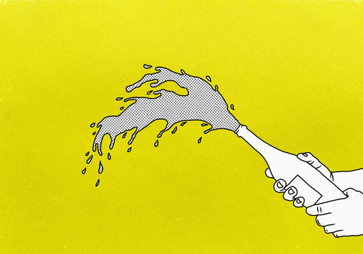 Exploding champagne on yellow background