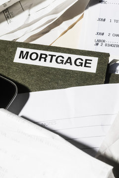 Close up mortgage file and finance paperwork